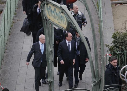 French President Francois Hollande arrives after a shooting at the Paris offices of Charlie Hebdo, a satirical newspaper