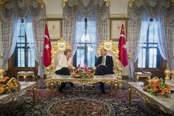 Turkish President Tayyip Erdogan (R) listens to German Chancellor Angela Merkel during their meeting in Istanbul, Turkey, October 18, 2015, in this handout courtesy of Bundesregierung. Germany is ready to help drive forward Turkey's European Union accession process, Merkel said on Sunday, extending support to Ankara in exchange for Turkish help in stemming the flow of refugees to Europe. REUTERS/Guido Bergmann/Bundesregierung/Handout via Reuters ATTENTION EDITORS - THIS PICTURE WAS PROVIDED BY A THIRD PARTY. REUTERS IS UNABLE TO INDEPENDENTLY VERIFY THE AUTHENTICITY, CONTENT, LOCATION OR DATE OF THIS IMAGE. FOR EDITORIAL USE ONLY. NOT FOR SALE FOR MARKETING OR ADVERTISING CAMPAIGNS. FOR EDITORIAL USE ONLY. NO RESALES. NO ARCHIVE. THIS PICTURE IS DISTRIBUTED EXACTLY AS RECEIVED BY REUTERS, AS A SERVICE TO CLIENTS.