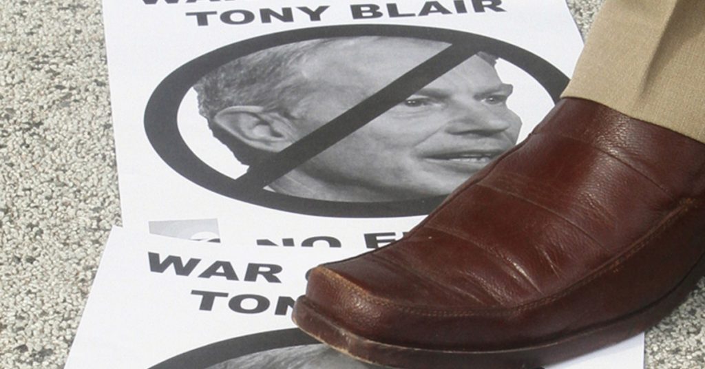 A protester steps on a portrait of Tony Blair during a rally against the former British prime minister in Petaling Jaya on April 24, 2010. About 100 angry protesters stomped on and burnt pictures of Tony Blair as the former British prime minister addressed a business gathering in Malaysia. AFP PHOTO / KAMARUL AKHIR (Photo credit should read KAMARUL AKHIR/AFP/Getty Images)