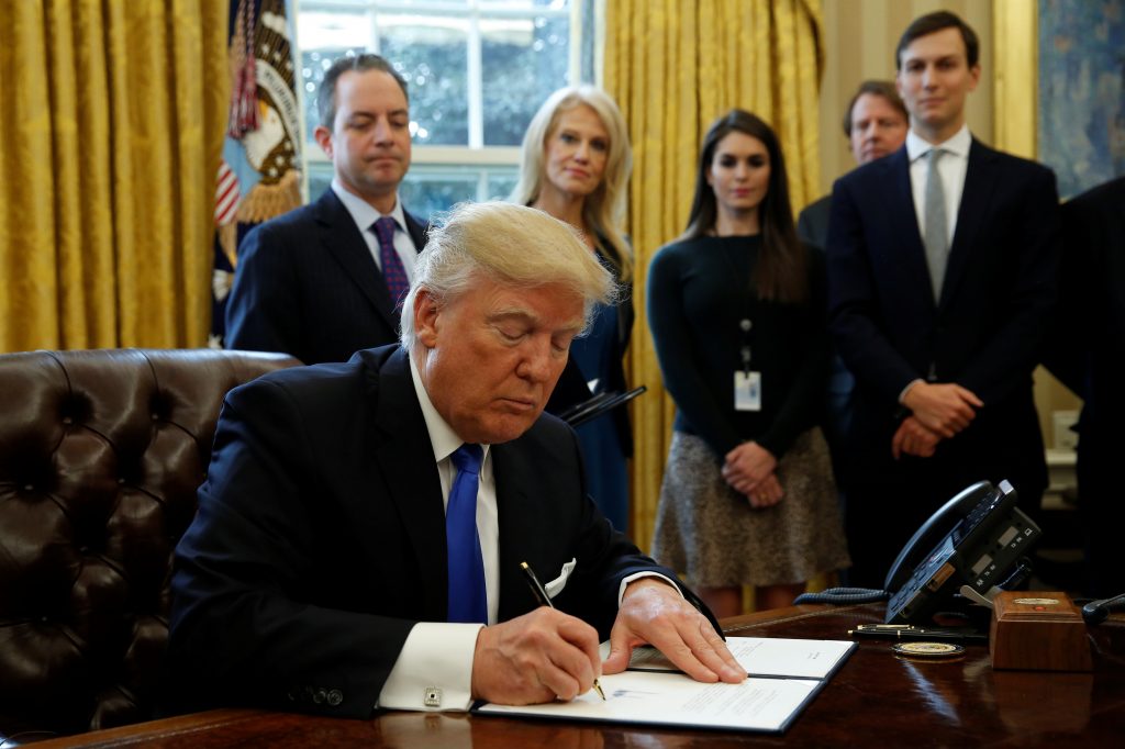 President Trump signs executive orders at the White House in Washington