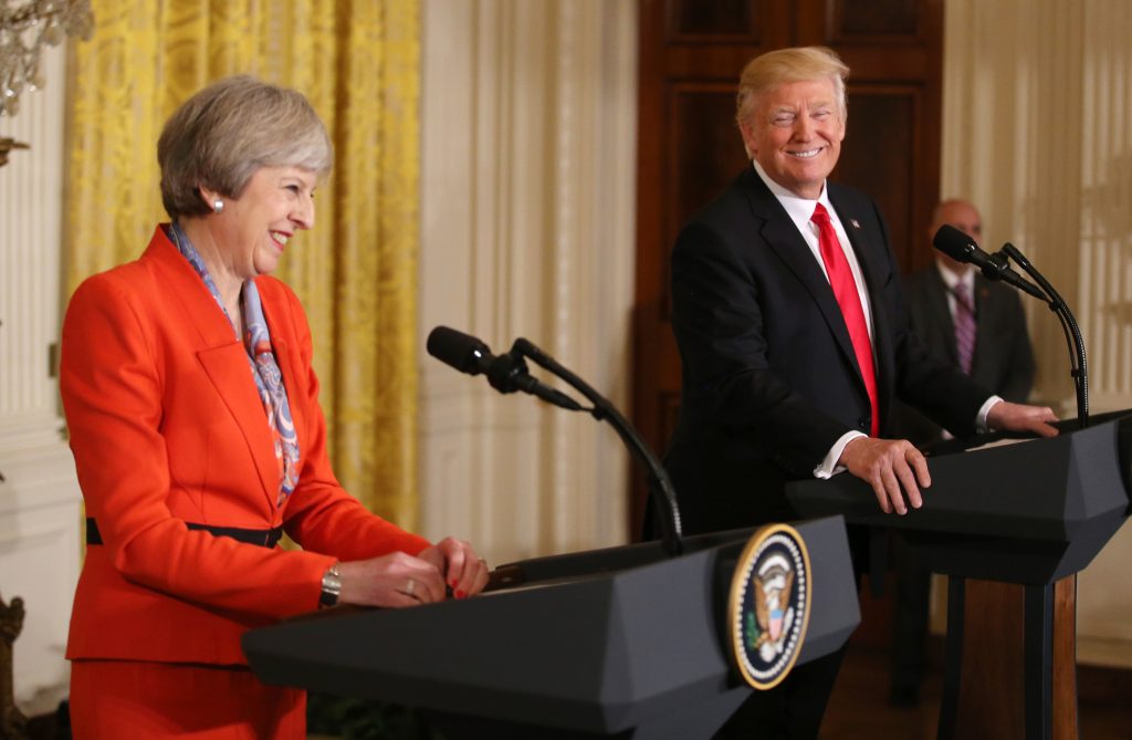 U.S. President Donald Trump and British Prime Minister Theresa May smile as they hold a joint news conference at the White House in Washington, U.S., January 27, 2017. REUTERS/Carlos Barria TPX IMAGES OF THE DAY
